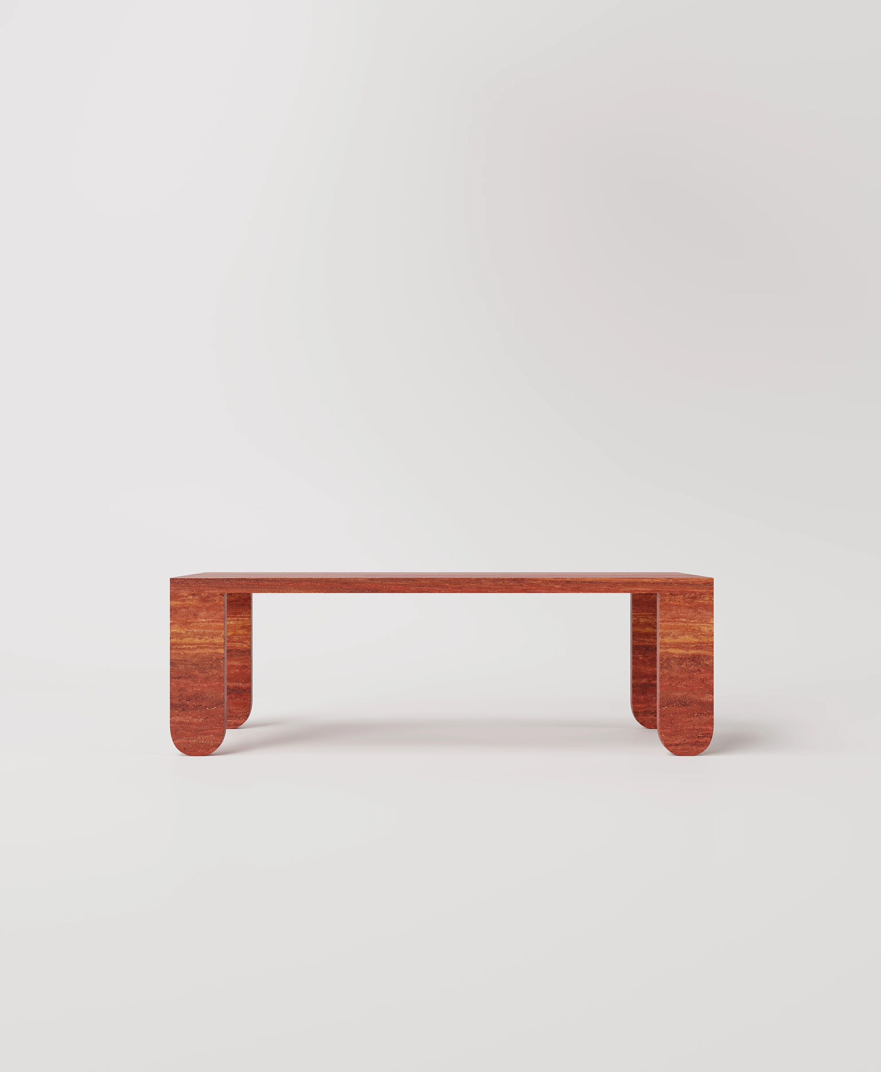 Большой стол с закругленными ножками из красного травертина