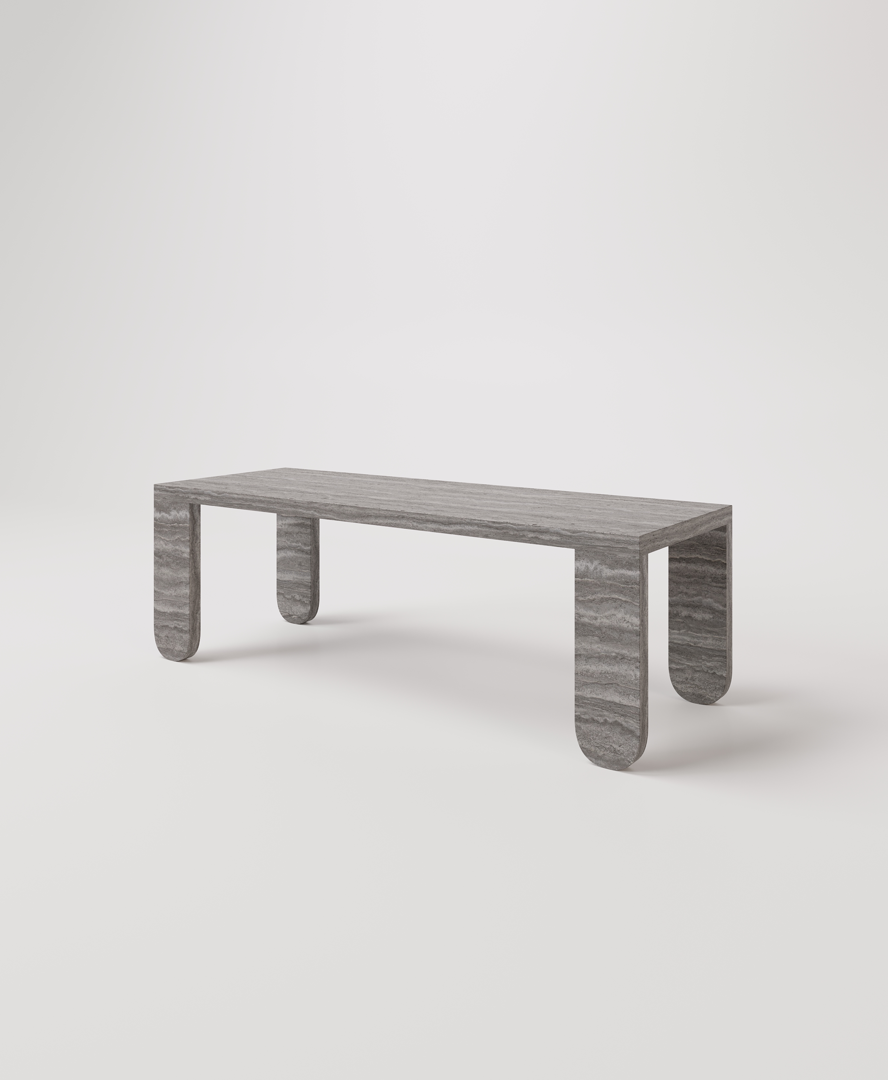 Большой стол с закругленными ножками из серого травертина